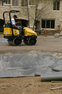 Roller flattening the ground